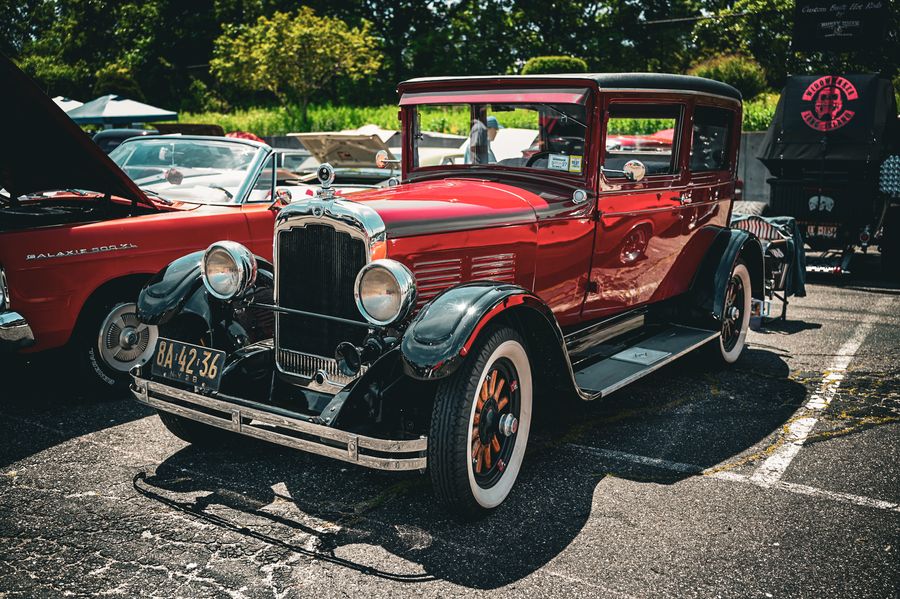 Antique red classic car at a summer car show