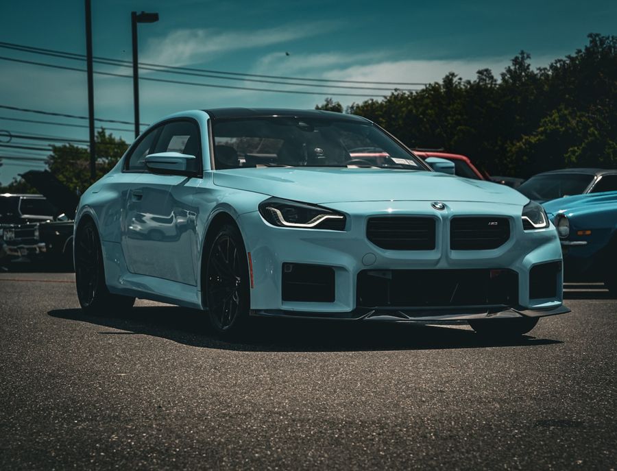 Blue BMW M2 photographed on the street