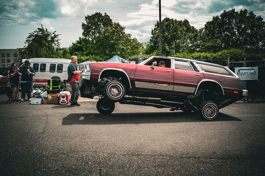 Lowrider wagon caught mid three-wheel