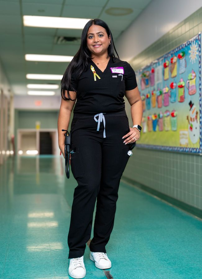 Healthcare professional portrait in a school hallway
