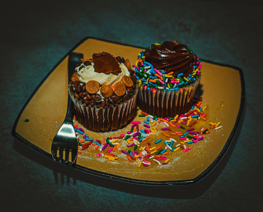 Chocolate and vanilla cupcakes with candy garnish